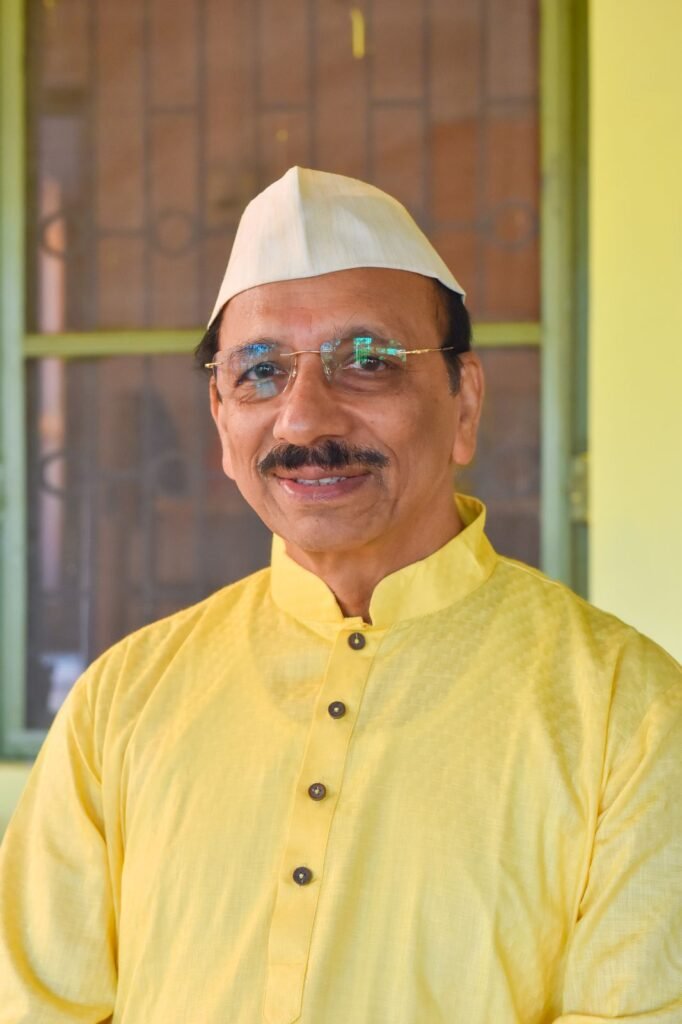 Dr. Vishwas Puranik in a traditional kurta and topi